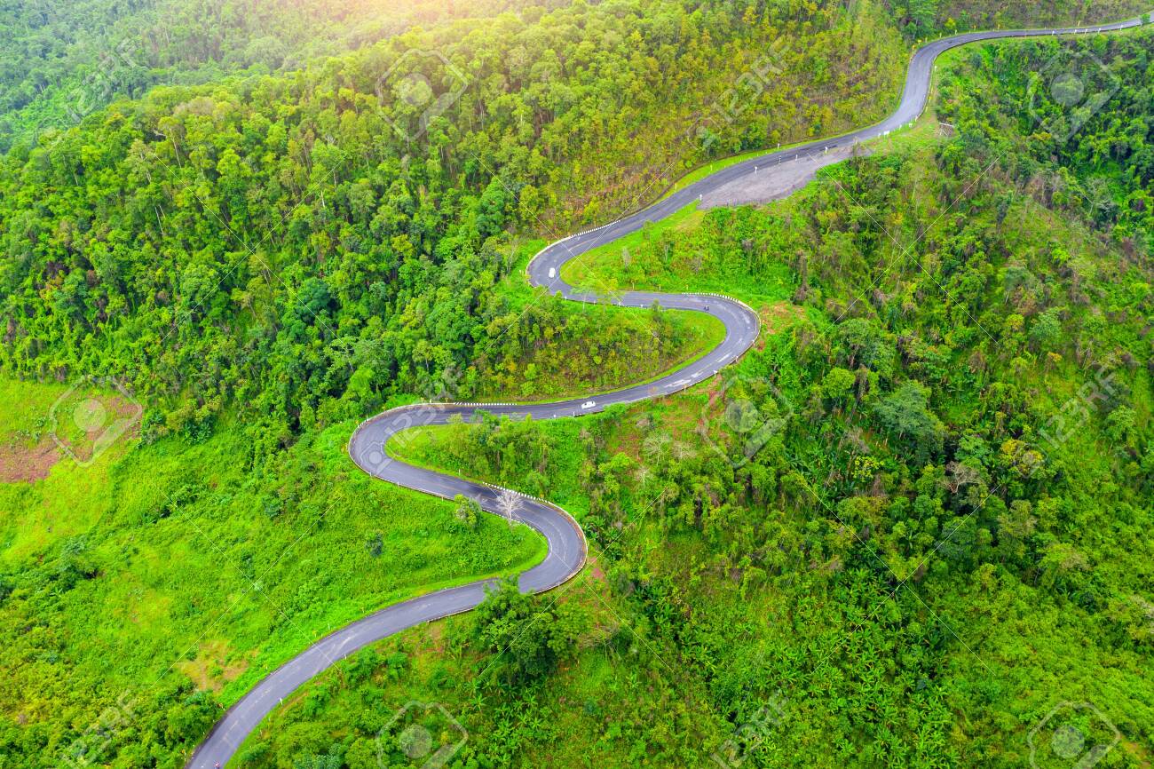Aerial view of Beautiful sky road over top of mountains with gre